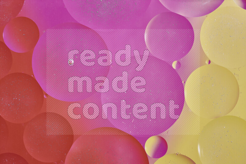 Close-ups of abstract oil bubbles on water surface in shades of yellow, orange and pink