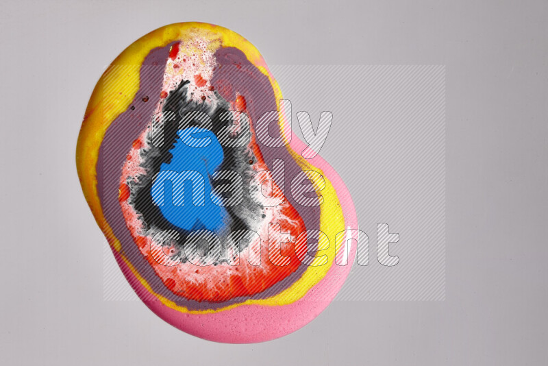 Close-ups of assorted colors blending on a grey background