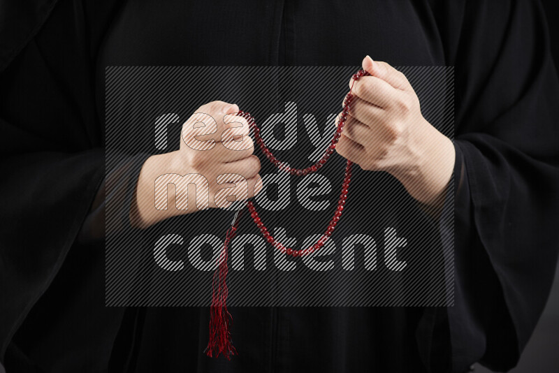 Woman hands holding praying beads (sebha) in different positions