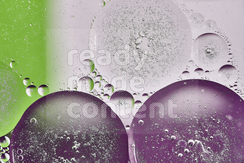 Close-ups of abstract oil bubbles on water surface in shades of purple, green and white