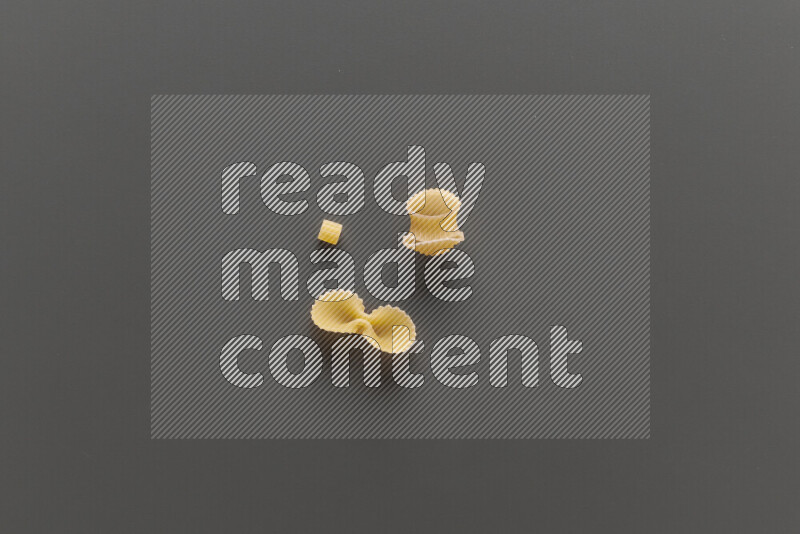 Different pasta types on grey background