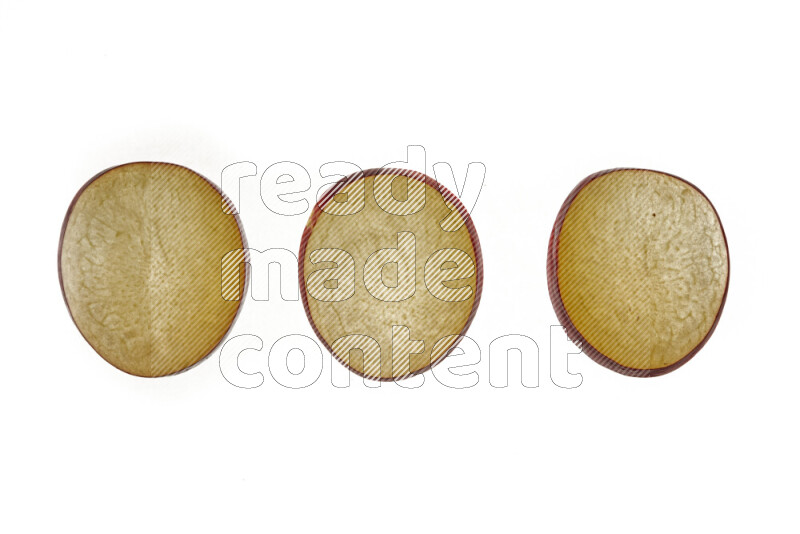 Plum slices on illuminated white background