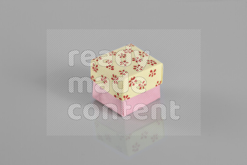 Origami gift box on grey background