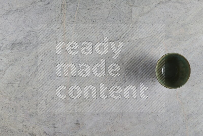 A multicolored pottery Bowl on grey marble background
