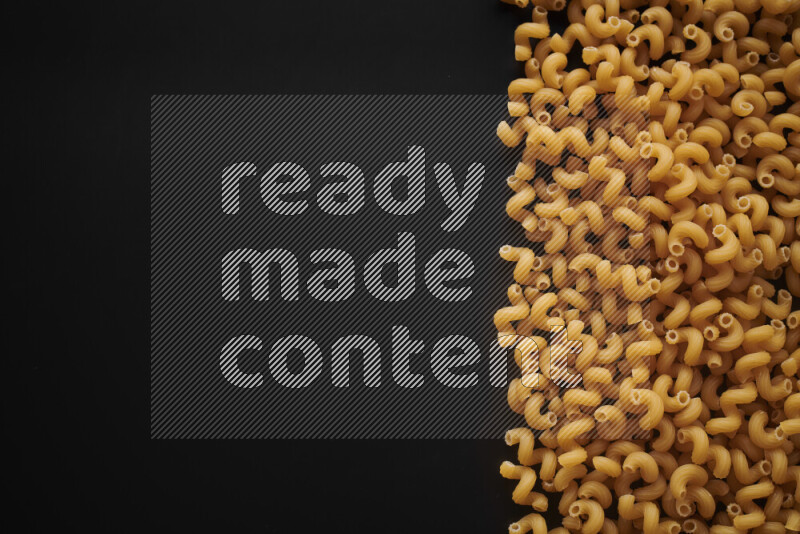 Different pasta types on black background