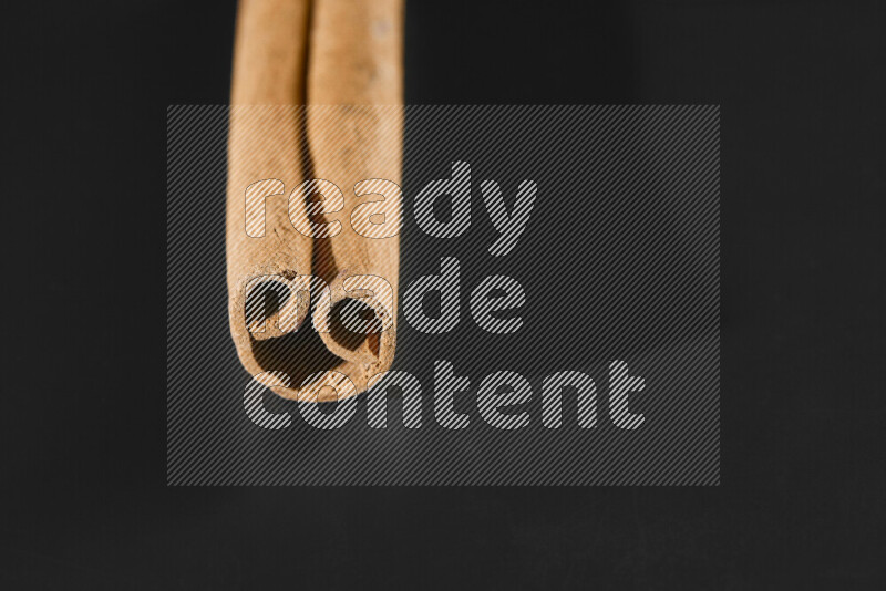 Cinnamon sticks on black background