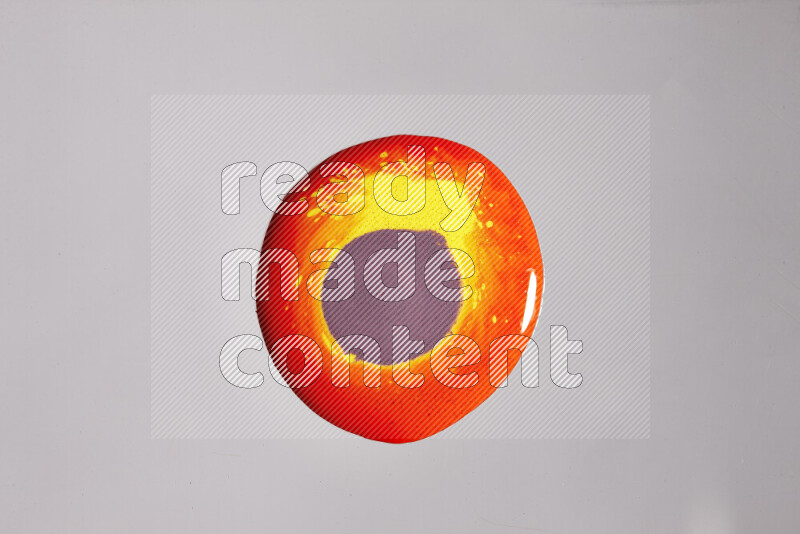 Close-ups of assorted colors blending on a grey background