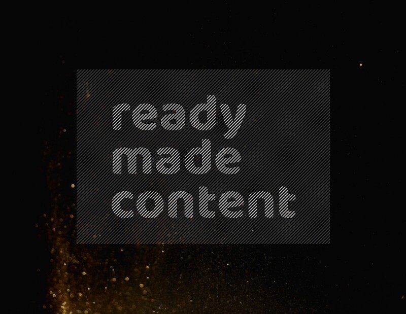 Gold glitter powder isolated on black background
