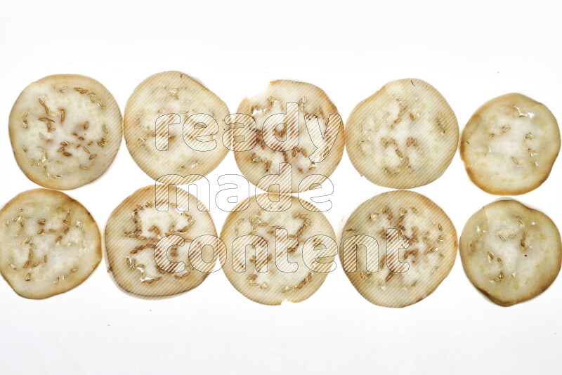 Eggplant slices on illuminated white background