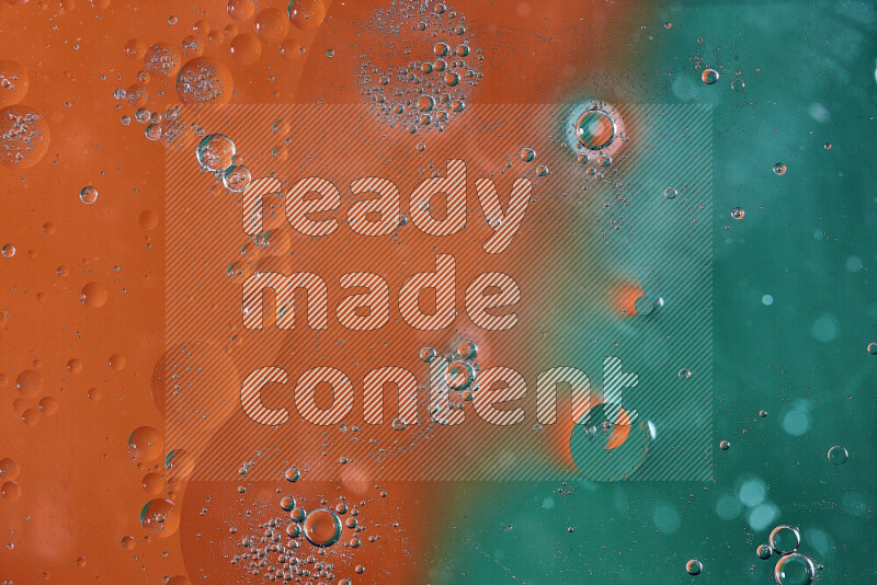 لقطات مقربة لفقاعات من الزيت على سطح الماء باللون الأخضر والبرتقالي