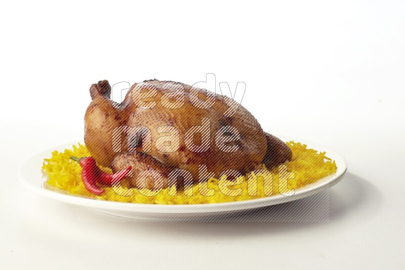 yellow  basmati Rice with  whole roasted chicken on a white rounded plate direct on white background