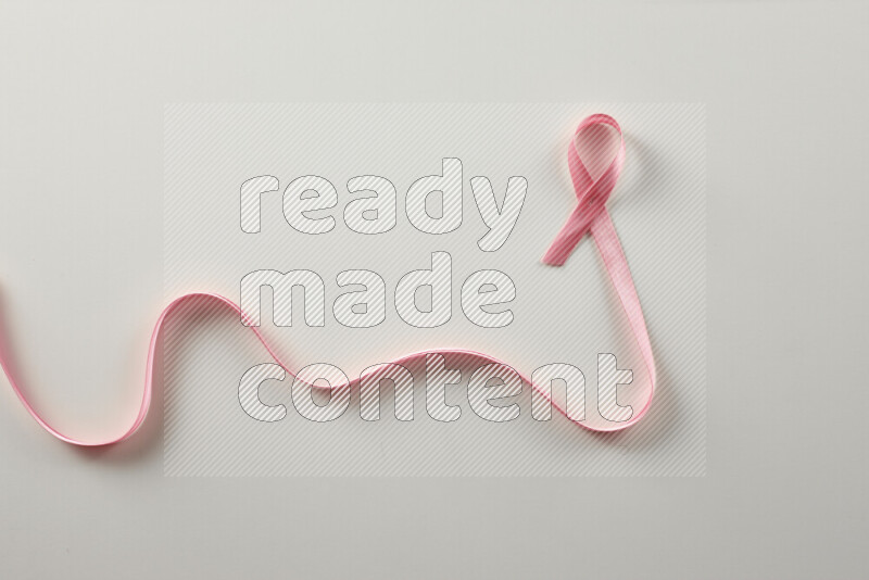 Pink ribbons on white background