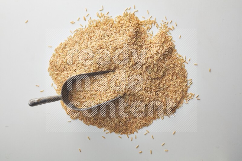 Long grain brown rice on white background