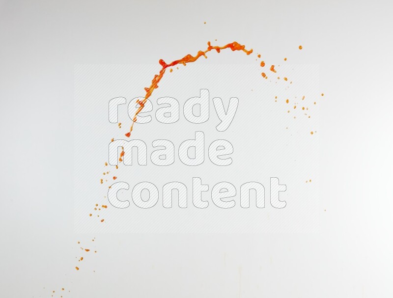 Orange liquid splash and drops on white background