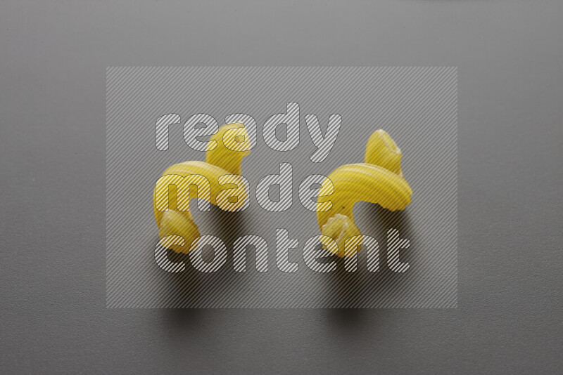 Twist pasta on grey background