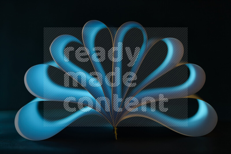 An abstract art piece displaying smooth curves in blue gradients created by colored light