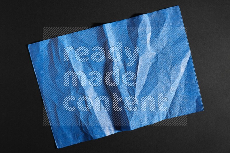 Colored plastic textures on black background