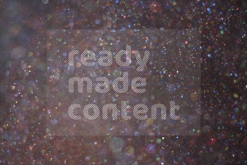 Multicolored glitter powder isolated on black background