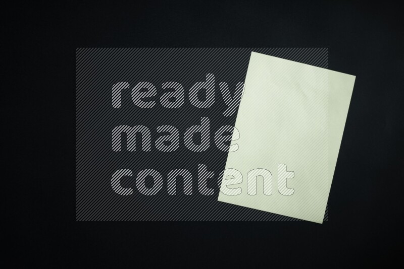 Multicolored paper sheet on black background