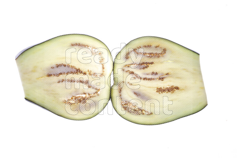 Eggplant slices on illuminated white background