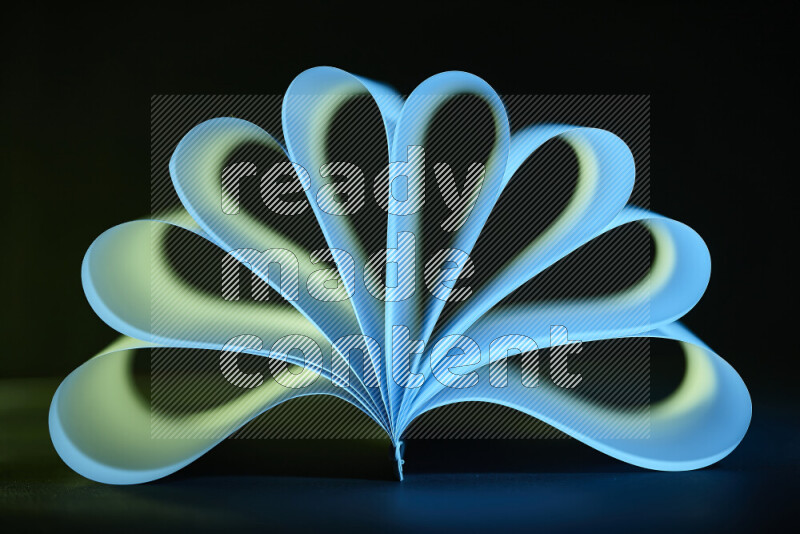 An abstract art piece displaying smooth curves in blue and green gradients created by colored light