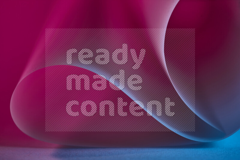 An abstract art piece displaying smooth curves in blue and pink gradients created by colored light