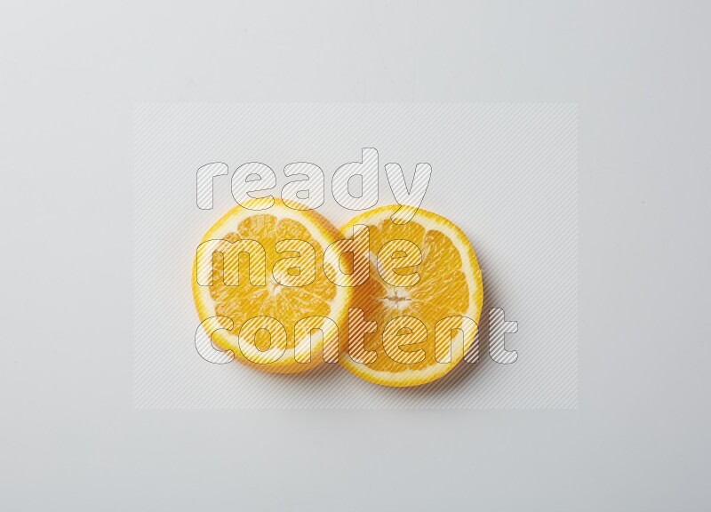 Two orange slices on white background