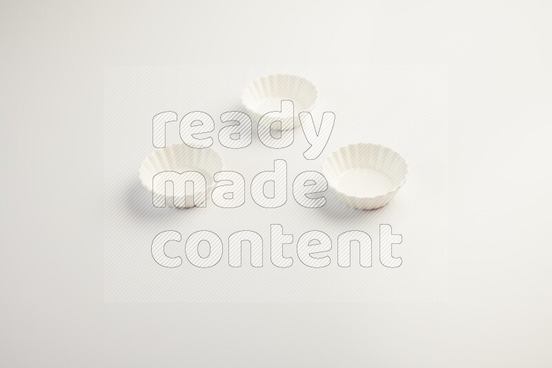 white ceramic round sauce dish on white countertop