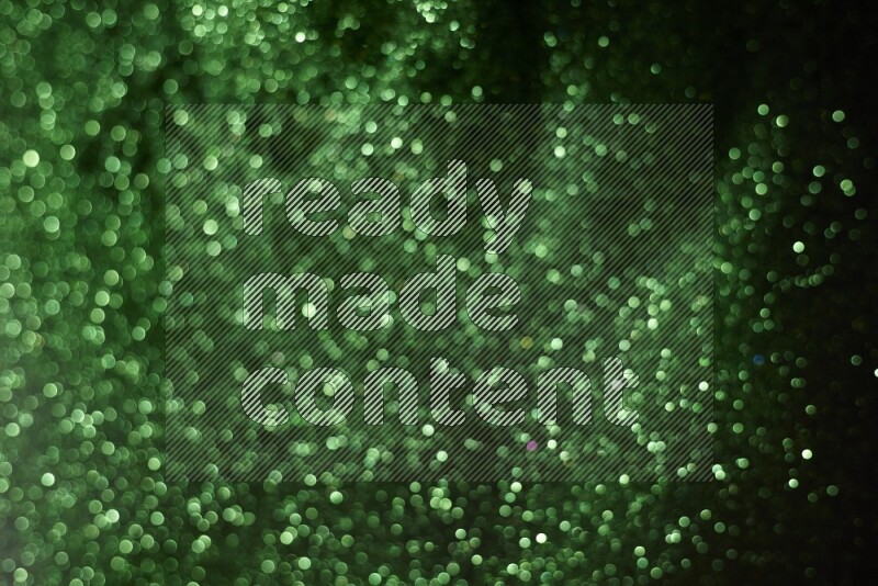 Green glitter powder isolated on black background
