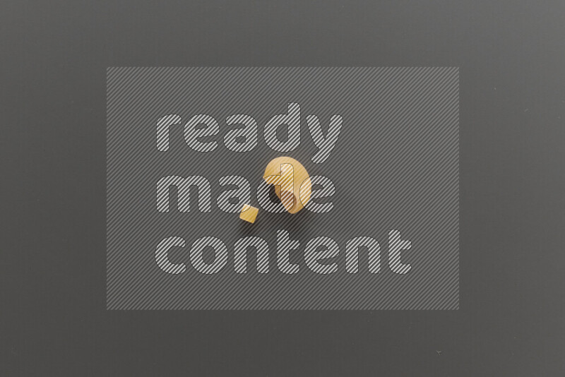 Small rings pasta with other types of pasta on grey background