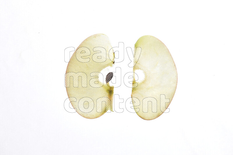 Apple slices on illuminated white background