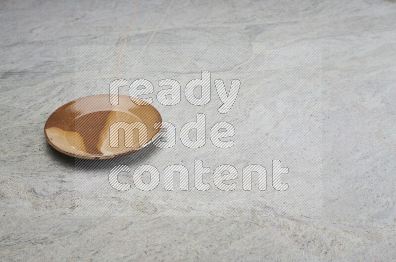 Multicolored Pottery Plate On Grey Marble Flooring