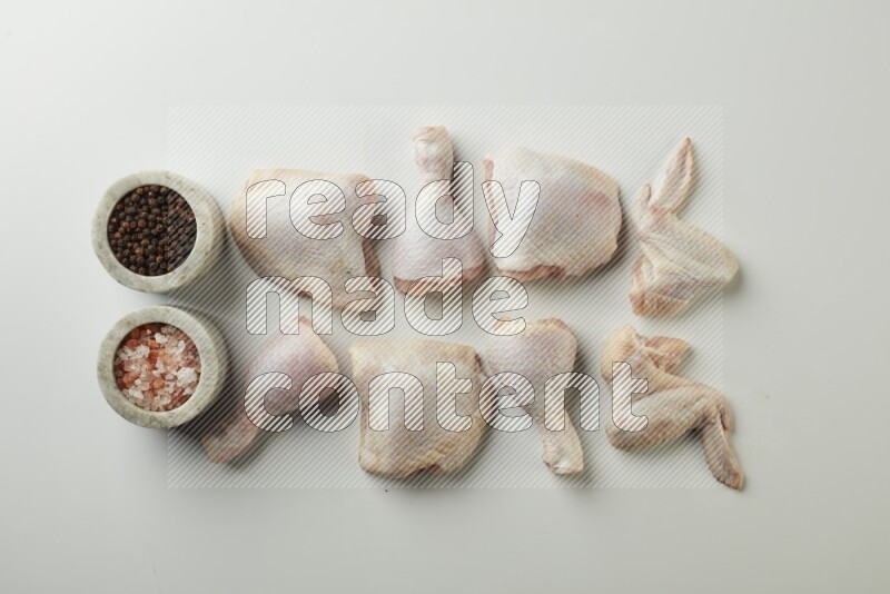 Mixed fresh chicken pieces direct on a white background