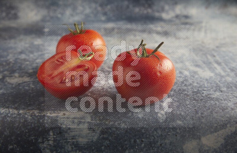 45 degree roma tomato on a textured rustic blue background