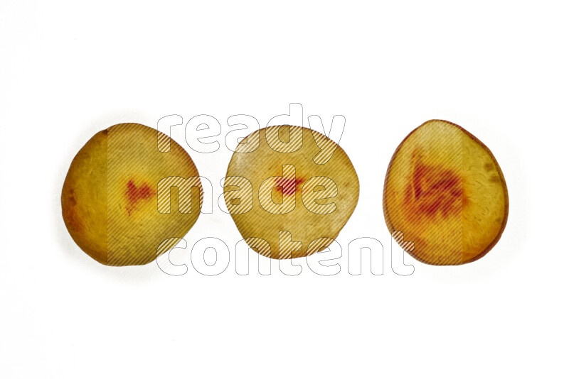 Peach slices on illuminated white background