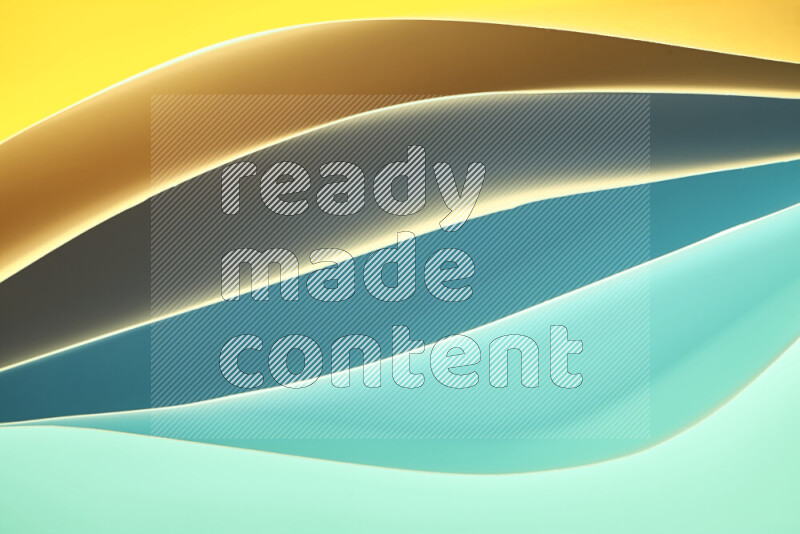This image showcases an abstract paper art composition with paper curves in green and yellow gradients created by colored light