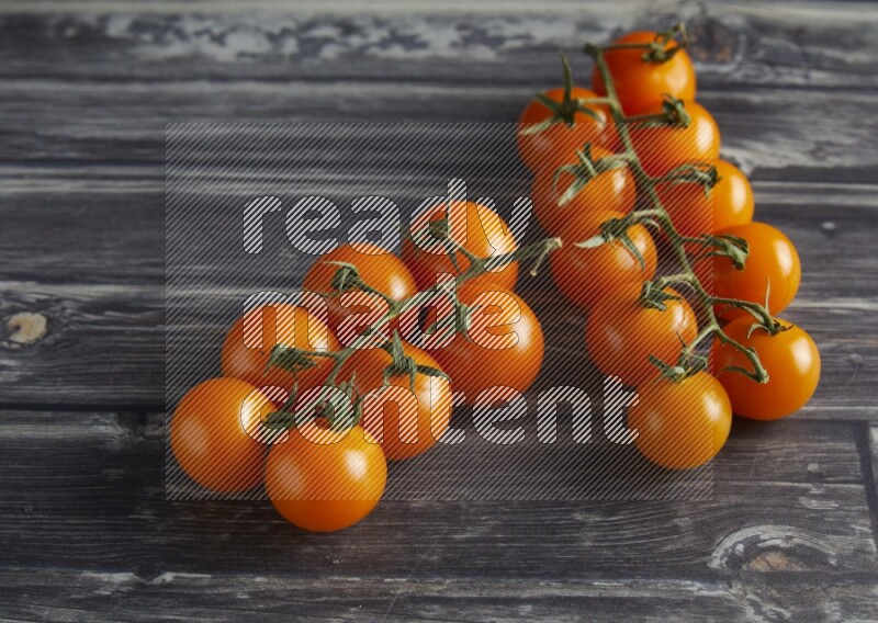 45 cherry tomato vein on a textured grey wooden background