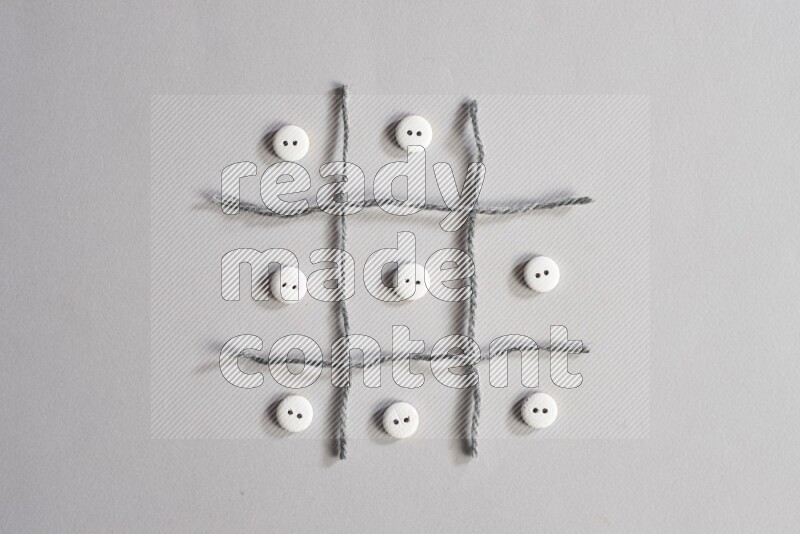 White buttons placed on grey background