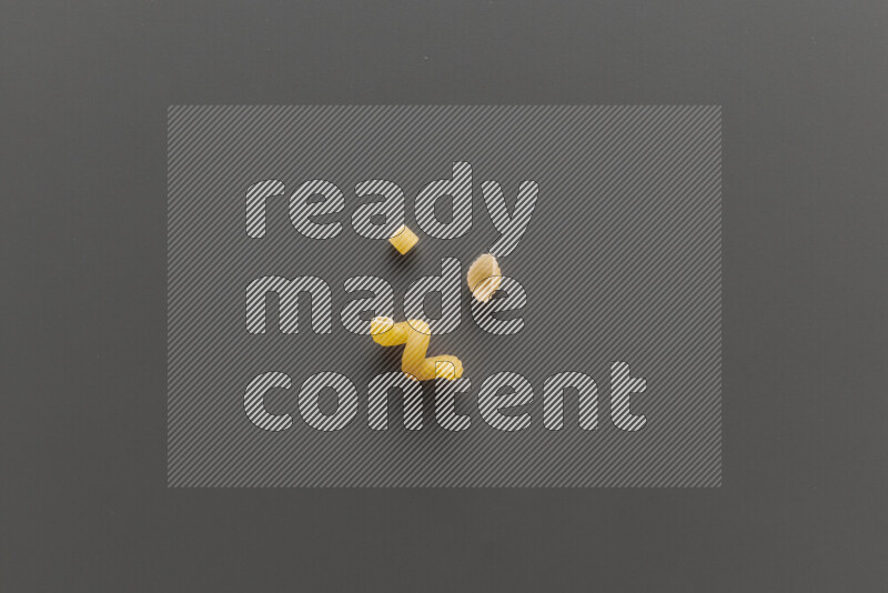 Different pasta types on grey background