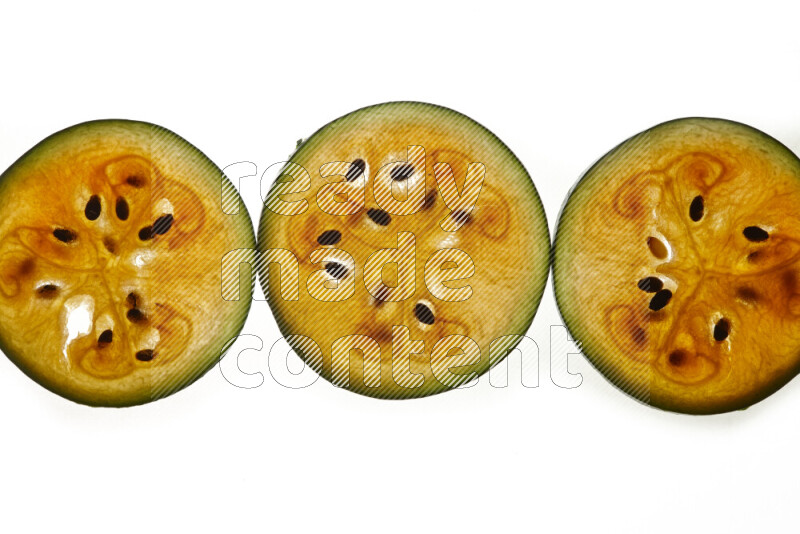 Watermelon slices on illuminated white background