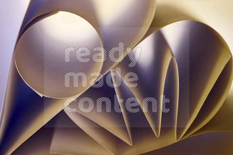 An artistic display of paper folds creating a harmonious blend of geometric shapes, highlighted by soft lighting in warm tones