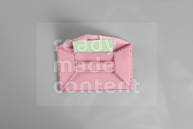 Origami envelope on grey background