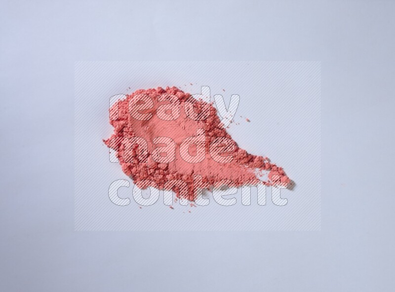 Red powder smears on white background