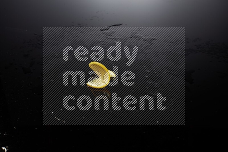 Lemon slice on black background