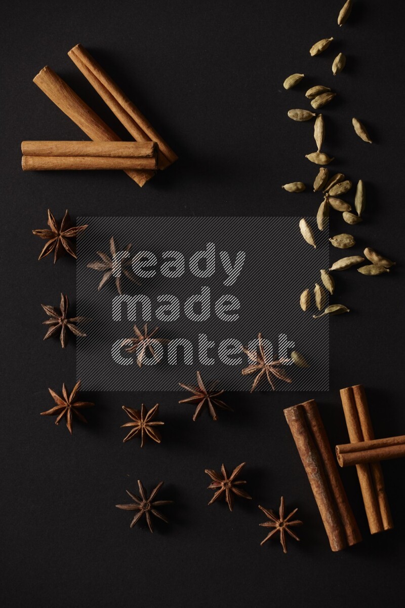Cinnamon Sticks, Cardamom and star anise on a black background