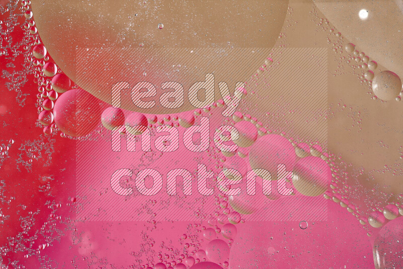 Close-ups of abstract oil bubbles on water surface in shades of brown, red and pink
