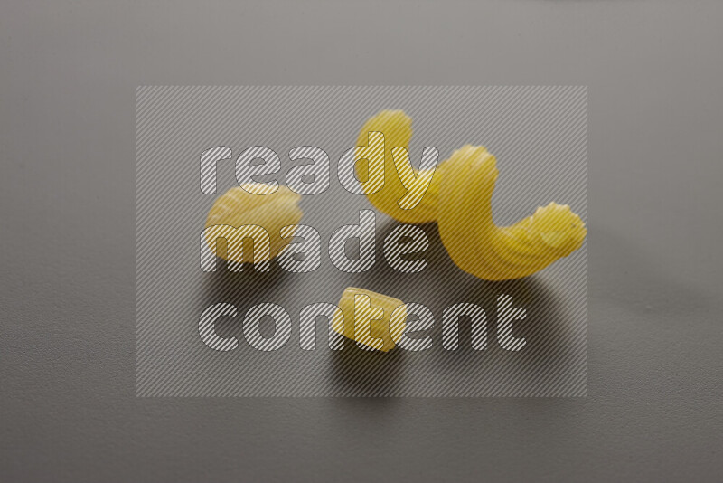 Different pasta types on grey background