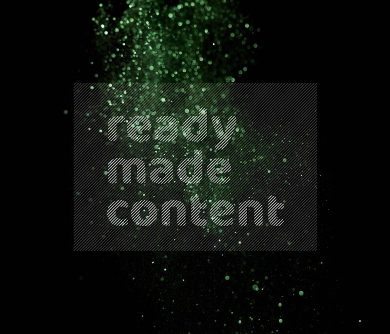Green glitter powder isolated on black background