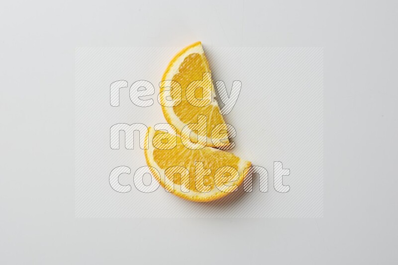 Two halves of an orange slices on white background