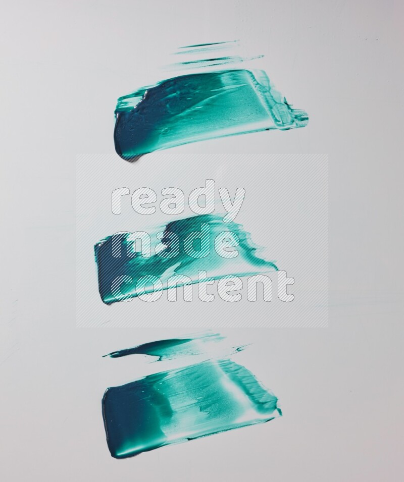 Turquoise painting knife strokes on white background